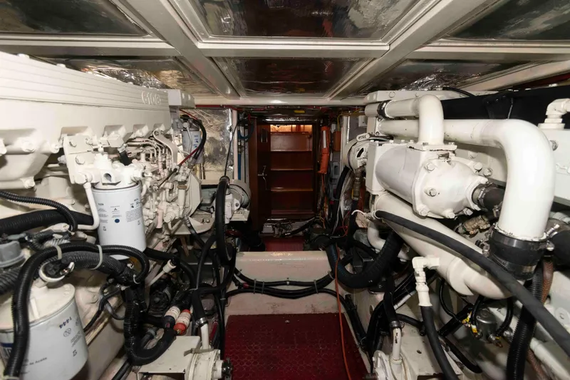 Slide: The Image of Engine room of 1999 Ocean Alexander 486/510 Classico yacht, showcasing mechanical components and systems. - 50