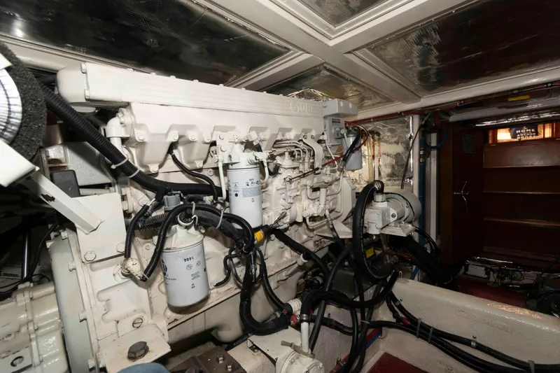 Slide: The Image of Engine room of 1999 Ocean Alexander 486/510 Classico yacht, showcasing detailed machinery and components. - 52
