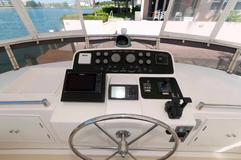 Slide: The Image of 1999 Ocean Alexander 486/510 Classico helm with navigation instruments and steering wheel. - 8