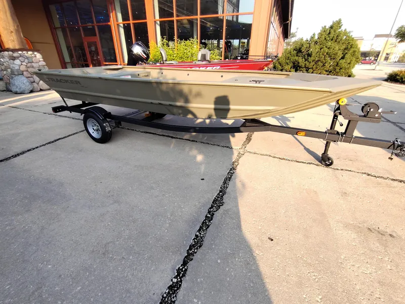 The Image of 2026 Tracker GRIZZLY 1648 AWL boat on trailer, parked outdoors. - 0