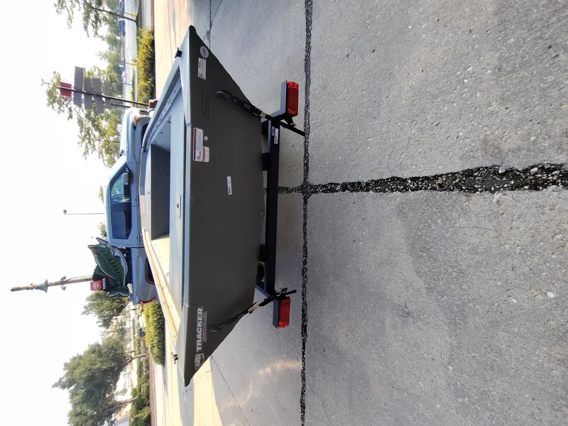 Slide: The Image of 2026 Tracker GRIZZLY 1648 AWL boat on trailer, parked on concrete surface. - 6