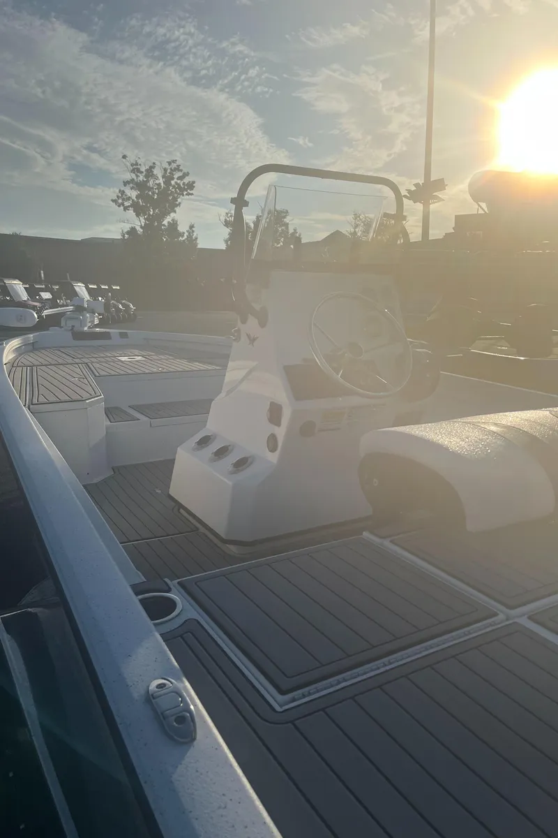 Slide: The Image of 2020 Vexus AVX2180CC boat interior with steering console, captured at sunrise. - 4