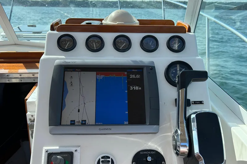 Slide: The Image of Control panel of a 2003 Surf-Hunter 25 boat with Garmin GPS display. - 4