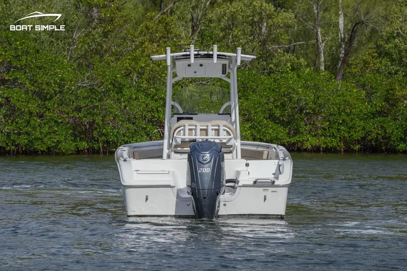 Slide: The Image of 2023 Sea Pro 219 Deep V CC boat on water, rear view with outboard motor. - 3
