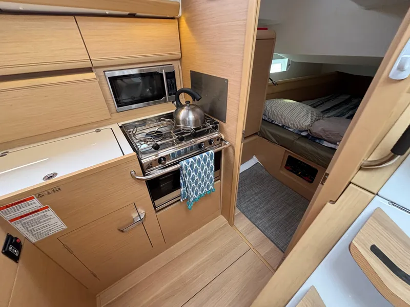 Slide: The Image of Cozy kitchen and bedroom in 2019 Jeanneau Sun Odyssey 419 yacht interior. - 16