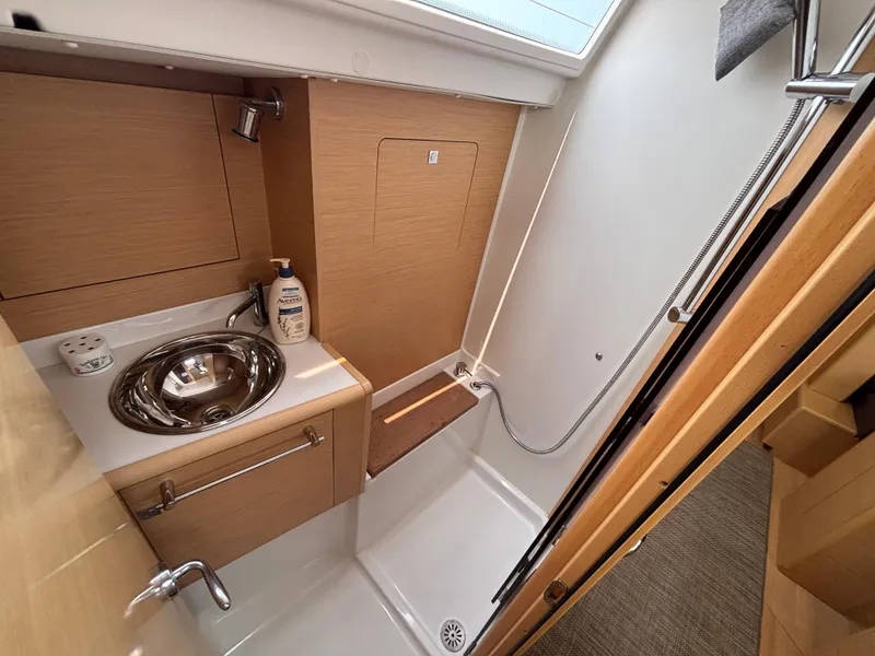 Slide: The Image of Modern bathroom in 2019 Jeanneau Sun Odyssey 419 yacht, featuring sink and shower. - 32