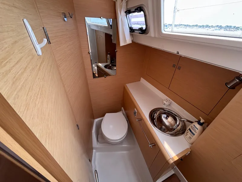 Slide: The Image of Modern bathroom in 2019 Jeanneau Sun Odyssey 419 yacht, featuring sleek design and compact amenities. - 34