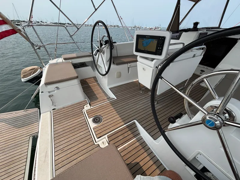 Slide: The Image of 2019 Jeanneau Sun Odyssey 419 cockpit with dual steering wheels and navigation system. - 47