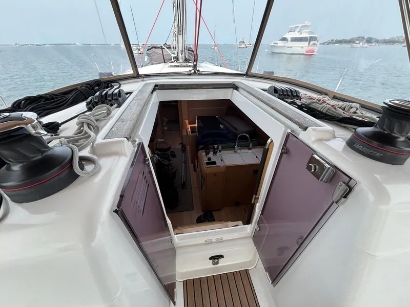 Slide: The Image of 2019 Jeanneau Sun Odyssey 419 sailboat interior view with open hatch and visible cabin. - 48