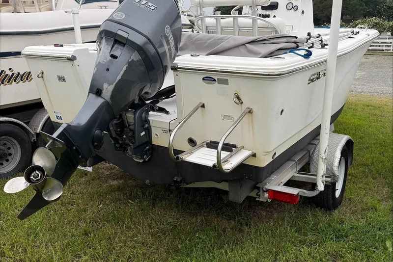 Slide: The Image of 2013 Sea Fox 199 Commander boat on trailer, rear view with outboard motor. - 5