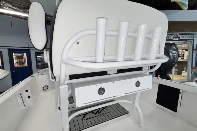 Slide: The Image of 2026 Tidewater 2110 Bay Max boat interior with rod holders and storage compartments. - 12