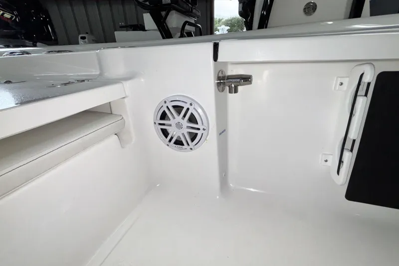 Slide: The Image of 2026 Tidewater 2110 Bay Max interior with speaker and storage compartment. - 14