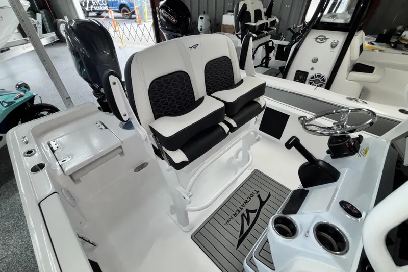 Slide: The Image of 2026 Tidewater 2110 Bay Max boat interior with dual seats and steering console. - 15