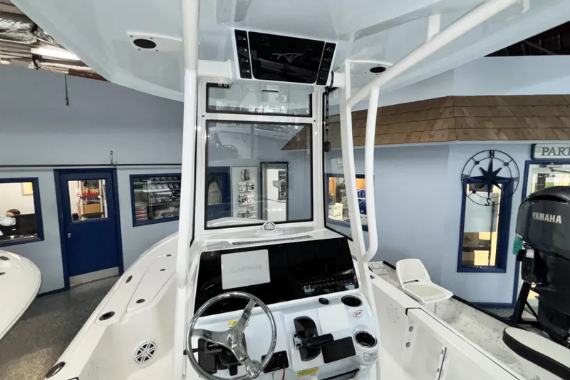 Slide: The Image of 2026 Tidewater 2110 Bay Max boat interior with Garmin navigation system and Yamaha engine. - 18