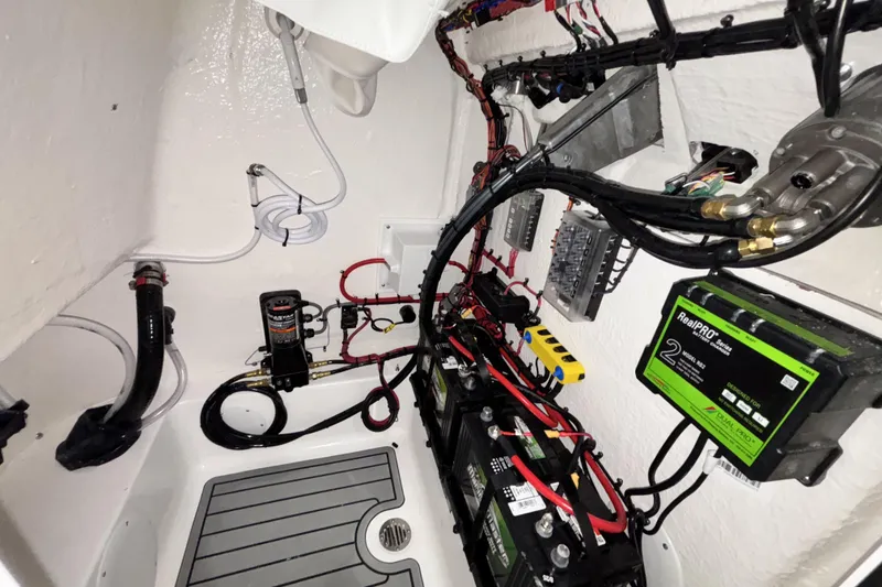Slide: The Image of 2026 Tidewater 2110 Bay Max boat electrical system with batteries and wiring. - 24