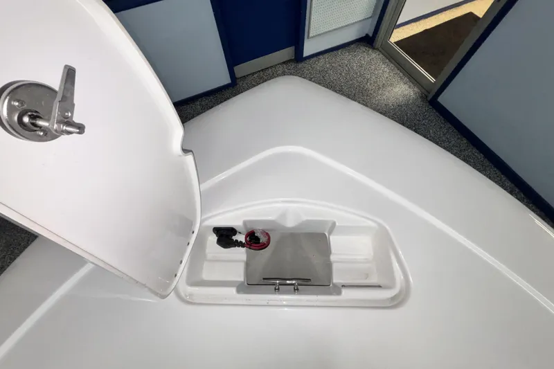 Slide: The Image of 2026 Tidewater 2110 Bay Max boat compartment with open hatch, showcasing interior details. - 32