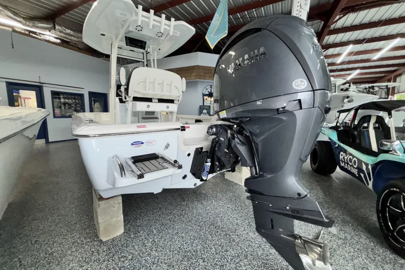 Slide: The Image of 2026 Tidewater 2110 Bay Max boat with Yamaha outboard motor in showroom. - 5