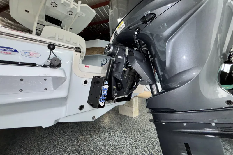 Slide: The Image of 2026 Tidewater 2110 Bay Max boat with Yamaha engine and Atlas jack plate in a showroom. - 8
