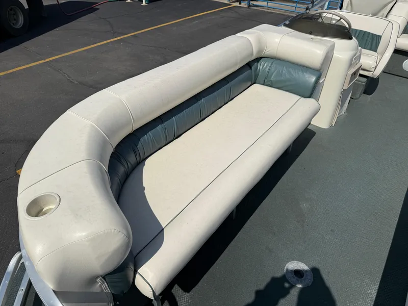 Slide: The Image of Pontoon boat interior with white and teal seating, Playbuoy Yachtsman 21, year 2000. - 8