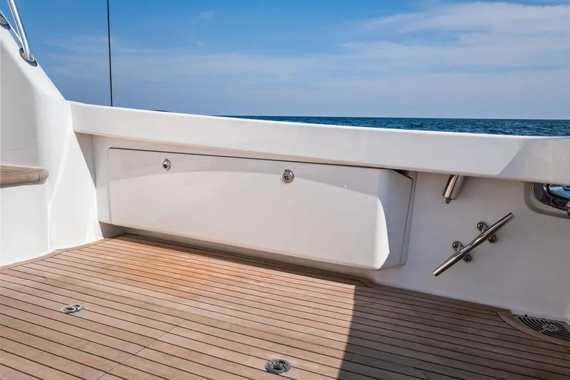Slide: The Image of 2017 Viking 62 Enclosed Bridge yacht deck with ocean view and sleek design. - 20