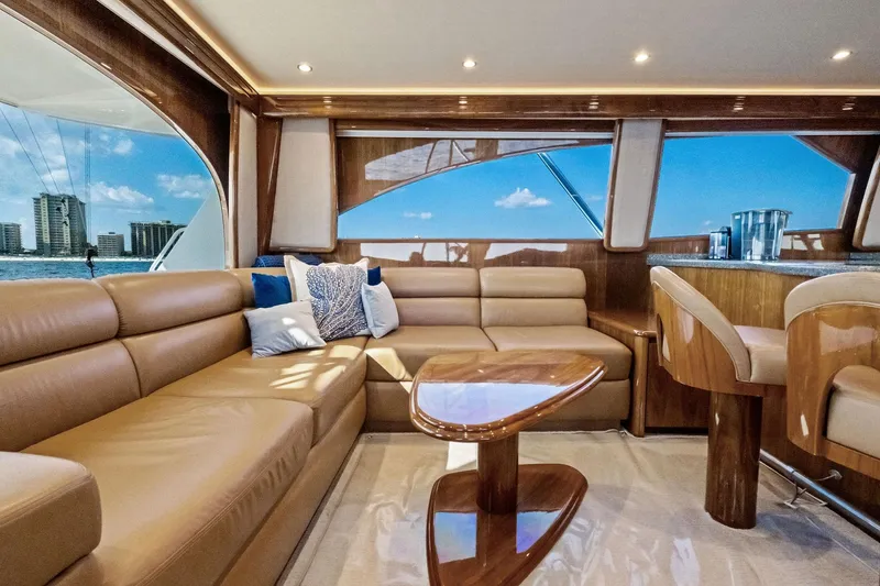 Slide: The Image of Luxurious interior of 2017 Viking 62 Enclosed Bridge yacht with leather seating and ocean view. - 25