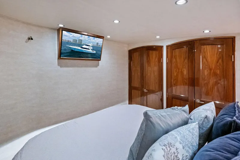Slide: The Image of Luxurious interior of 2017 Viking 62 Enclosed Bridge yacht with TV and wooden doors. - 35