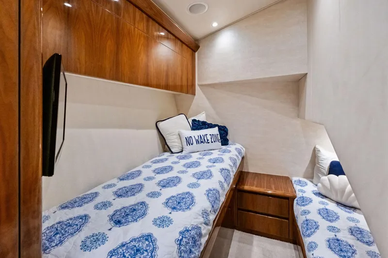 Slide: The Image of Luxurious cabin interior of 2017 Viking 62 Enclosed Bridge yacht with twin beds. - 45
