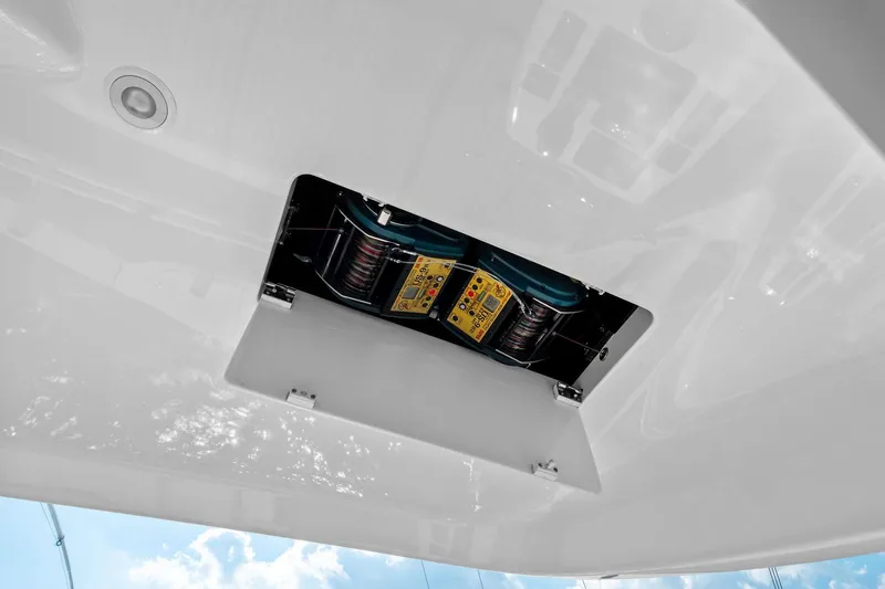 Slide: The Image of 2017 Viking 62 Enclosed Bridge boat winch system, viewed from below, with open hatch. - 62