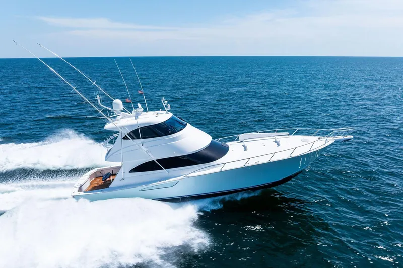 Slide: The Image of 2017 Viking 62 Enclosed Bridge yacht cruising on open sea. - 75