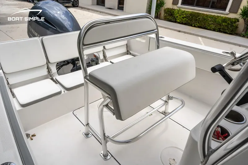 Slide: The Image of 2020 Release 210 RX boat interior with white seating and stainless steel frame. - 10