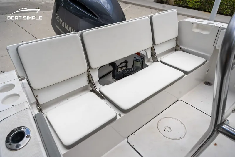 Slide: The Image of 2020 Release 210 RX boat with white cushioned seating and Yamaha engine. - 11