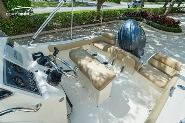 Slide: The Image of 2024 Scout 195 Sportfish boat interior with seating and controls, featuring a sleek design. - 4