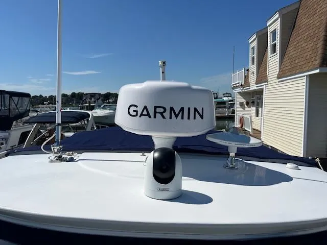 Slide: The Image of 2022 Monterey 295 Sport Yacht with Garmin radar at marina. - 11
