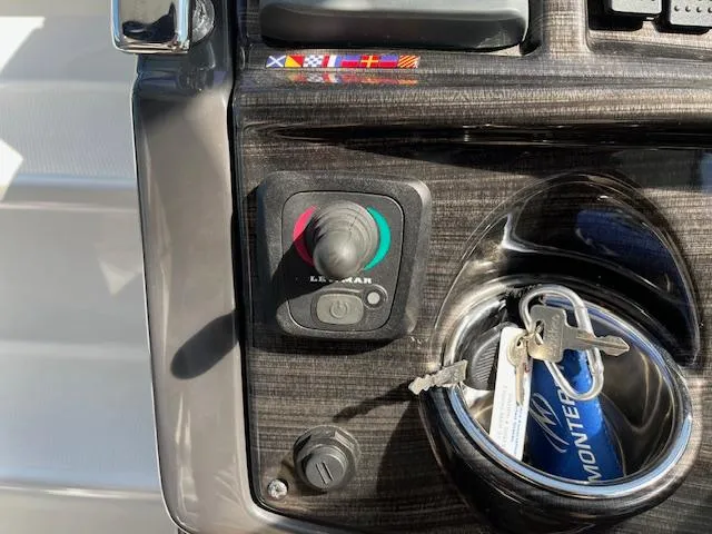 Slide: The Image of Control panel of 2022 Monterey 295 Sport Yacht with joystick and keys. - 15
