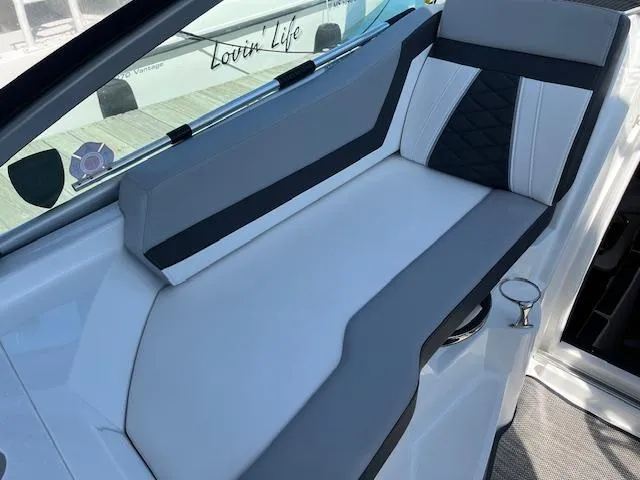 Slide: The Image of 2022 Monterey 295 Sport Yacht interior seating with modern design and comfortable upholstery. - 17