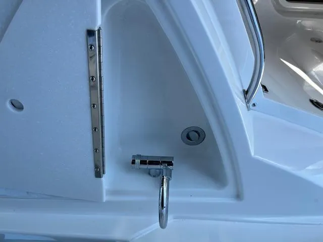 Slide: The Image of 2022 Monterey 295 Sport Yacht interior detail with chrome fixtures and white finish. - 29