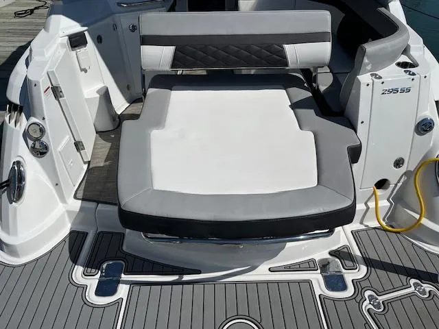 Slide: The Image of 2022 Monterey 295 Sport Yacht seating area with modern design and gray accents. - 30