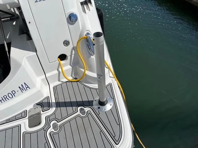 Slide: The Image of 2022 Monterey 295 Sport Yacht stern with dockside power connection and non-slip deck. - 31