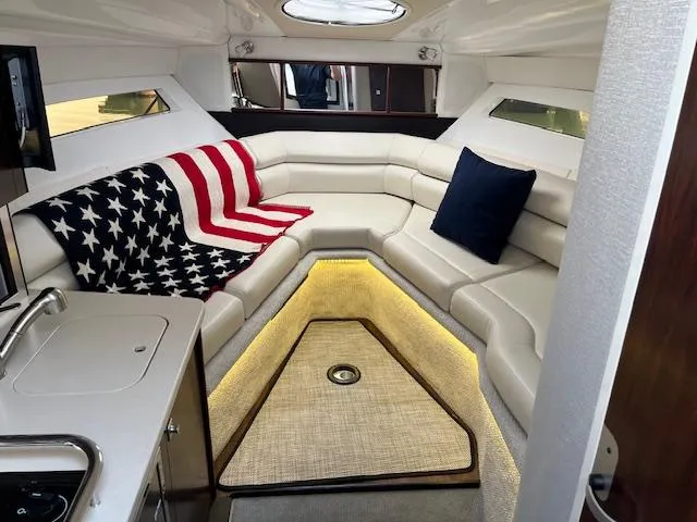 Slide: The Image of Luxurious interior of 2022 Monterey 295 Sport Yacht with American flag decor. - 32