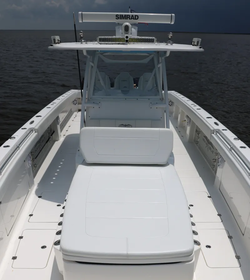 Slide: The Image of 2018 Invincible 40 Catamaran with Simrad electronics, spacious deck, and comfortable seating. - 21