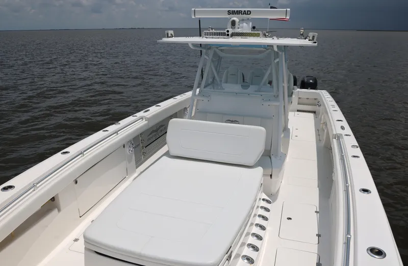 Slide: The Image of 2018 Invincible 40 Catamaran on open water, featuring spacious deck and modern design. - 22