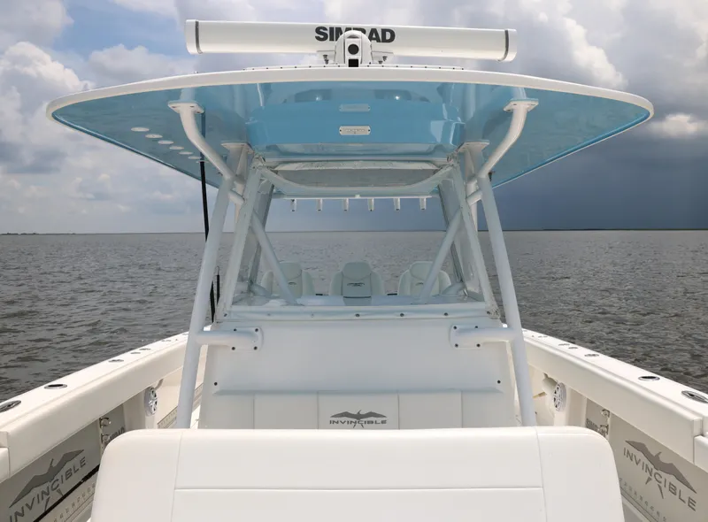 Slide: The Image of 2018 Invincible 40 Catamaran on open water, featuring a sleek design and spacious deck. - 23