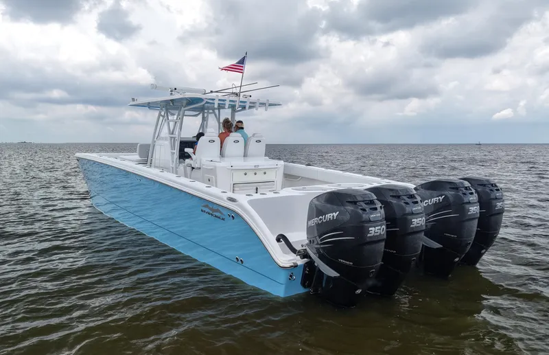 Slide: The Image of 2018 Invincible 40 Catamaran with four Mercury 350 engines on open water. - 5