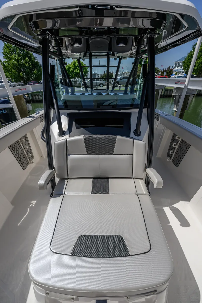 Slide: The Image of 2019 Wellcraft 352 Fisherman boat interior with cushioned seating and sleek design. - 10