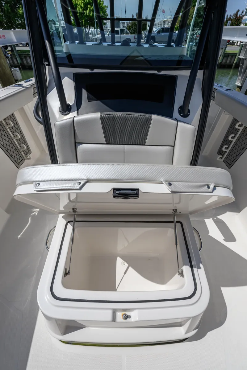 Slide: The Image of 2019 Wellcraft 352 Fisherman boat with open storage compartment, showcasing sleek design and functionality. - 11