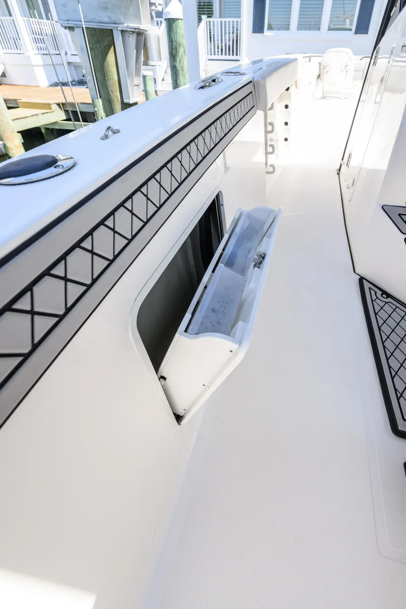 Slide: The Image of 2019 Wellcraft 352 Fisherman boat interior with storage compartment open. - 24