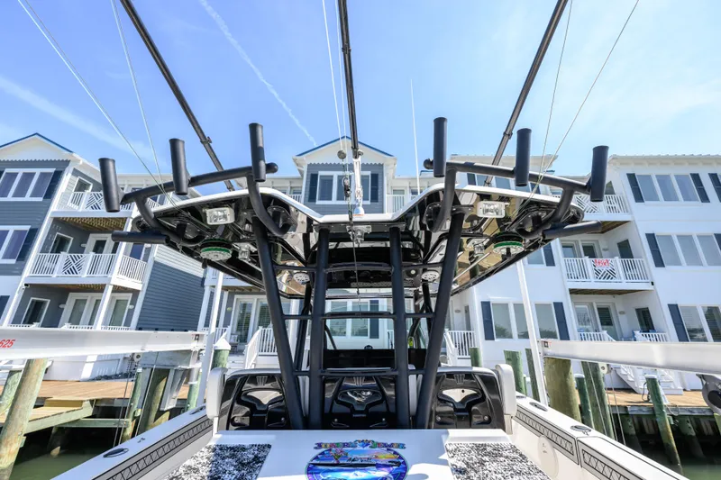 Slide: The Image of 2019 Wellcraft 352 Fisherman boat docked near waterfront homes. - 27