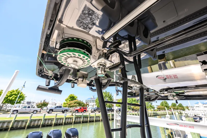 Slide: The Image of 2019 Wellcraft 352 Fisherman boat with detailed view of fishing equipment and docked marina. - 29