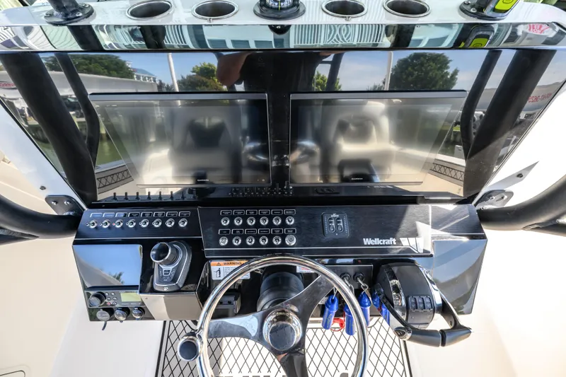 Slide: The Image of 2019 Wellcraft 352 Fisherman helm with dual displays and control panel. - 31