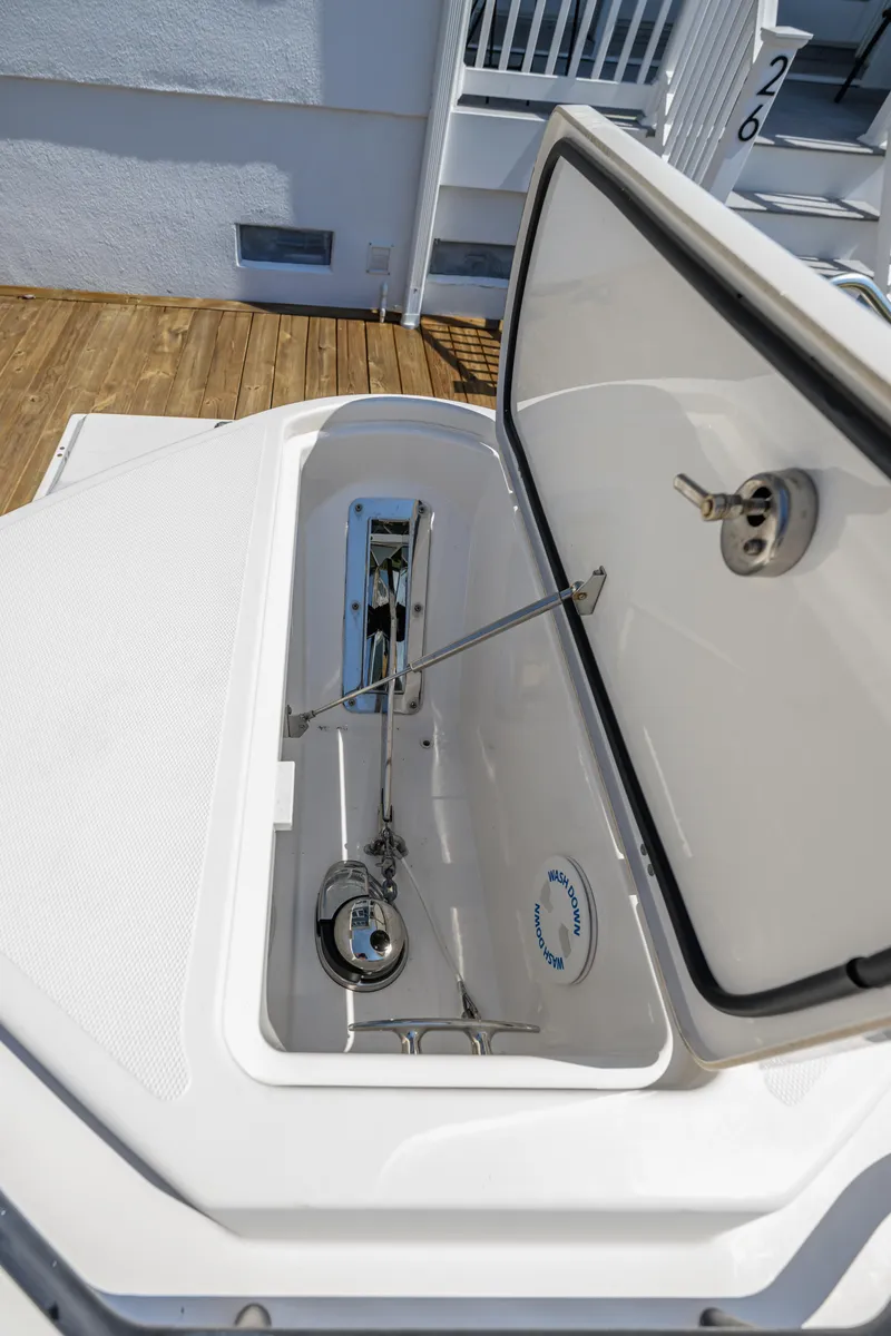Slide: The Image of Open storage compartment on 2019 Wellcraft 352 Fisherman boat, showcasing interior details. - 37